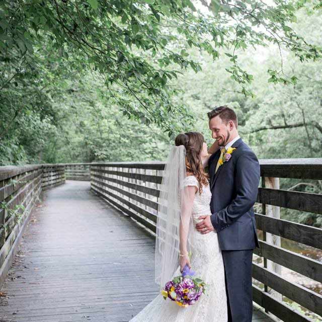 bride and groom on a bridge